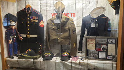 Veterans Display Case with Clothes