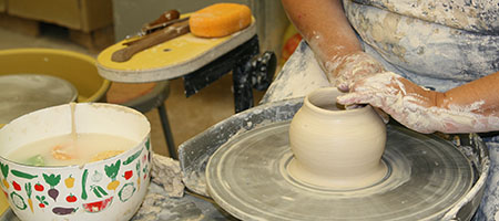 Person at pottery wheel