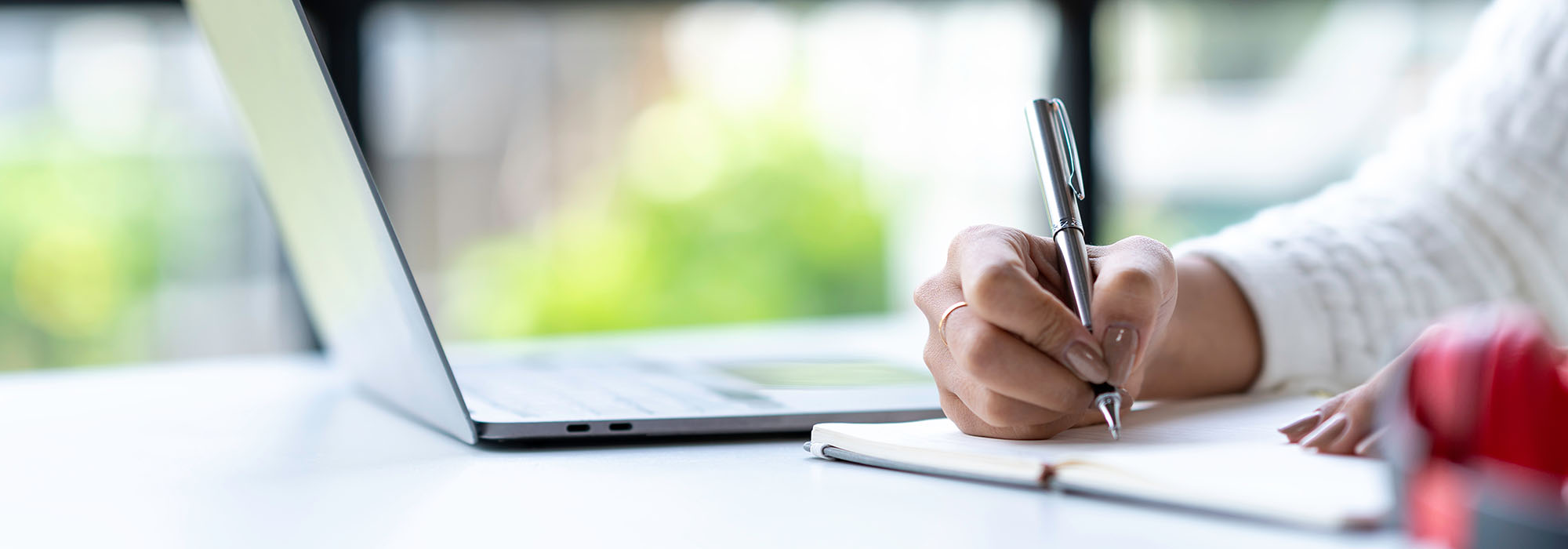 Student in online class with computer.