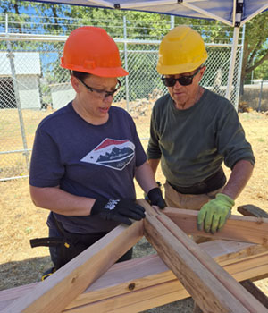 Two students with roof joices