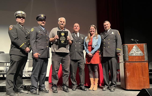 Dan Ballard receiving award.