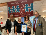 Debbie Derby, Kathy Koon, and Mark Fields accepting award