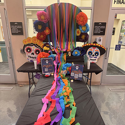 CalFresh Outreash with students dressed as vegitables