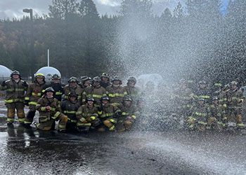 CalFresh Outreash with students dressed as vegitables