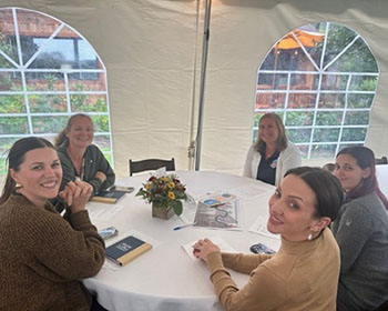Business representatives sitting at tables