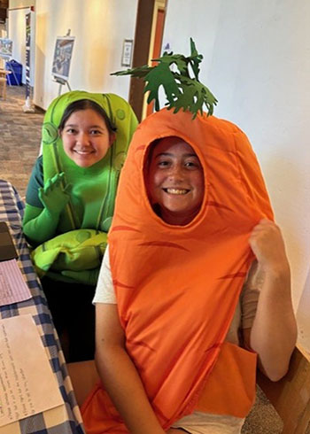 CalFresh Outreash with students dressed as vegitables