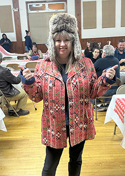 39th Annual COS Foundation Scholarship Fundraising Dinner and Auction. Dawnie Slabaugh with hat and coat.