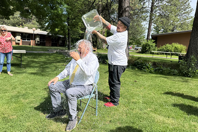 Annual Spring Staff Appreciation and Retirement Recognition Event - Vice President of Academic Affairs gets icke bucket poured on him. 
